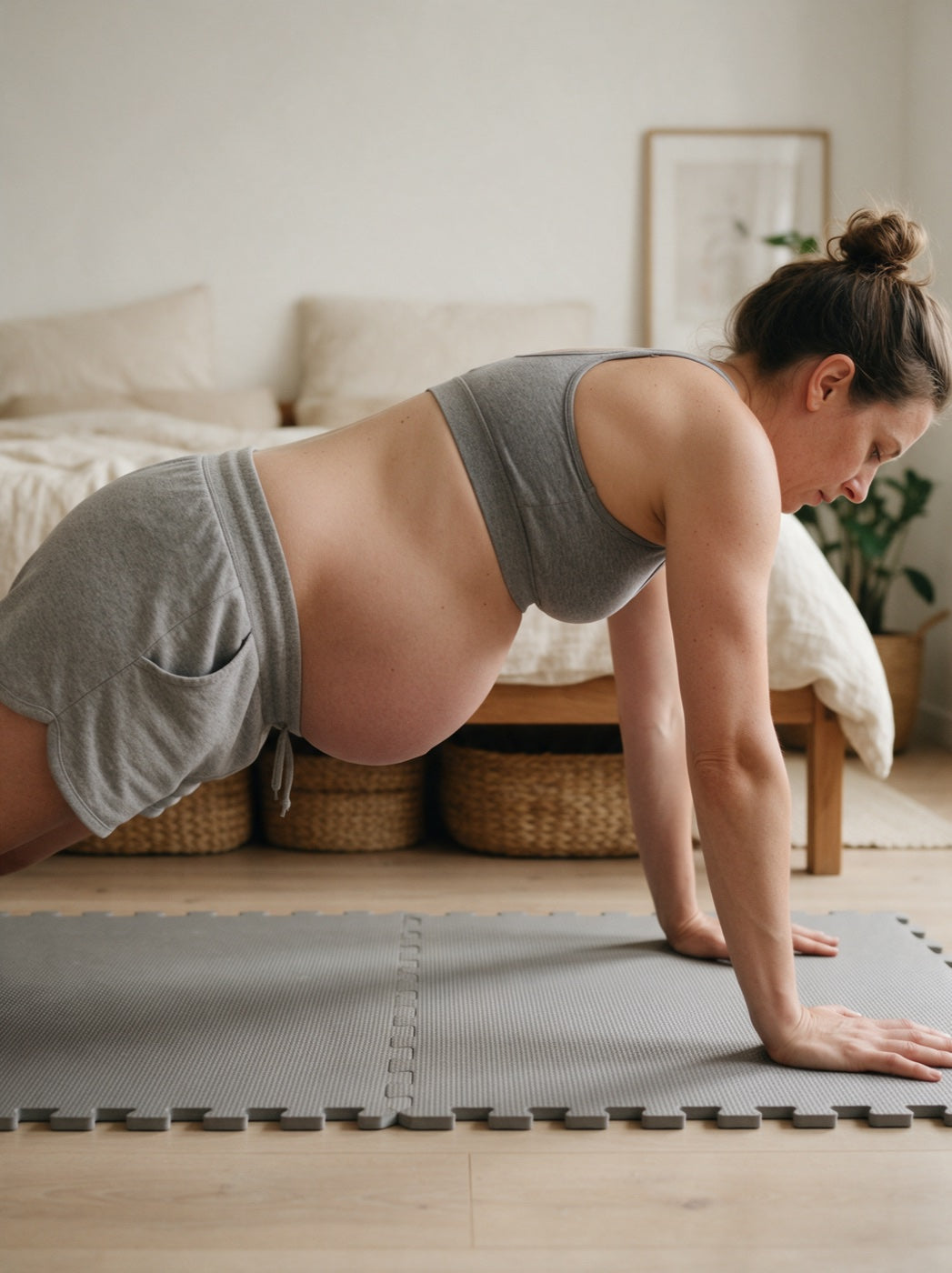 Woman doing a plank, abdominal doming visible